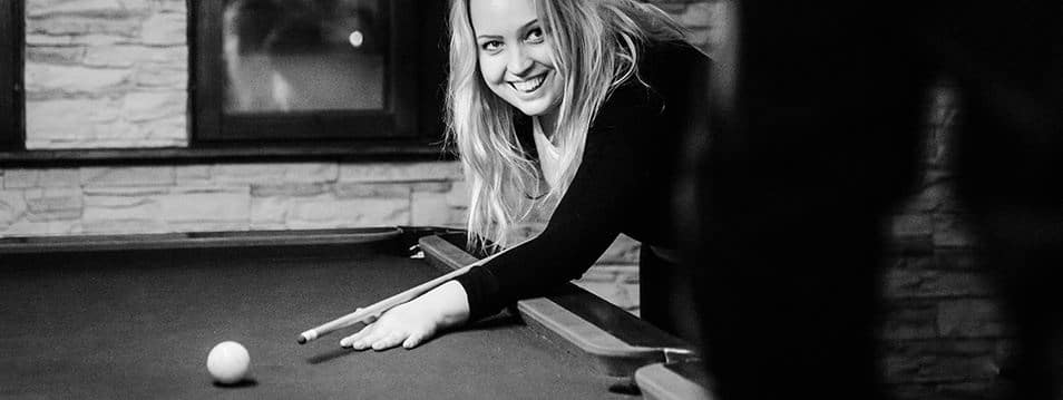 
A happy employee playing pool at the company's summer party. The relaxed atmosphere of the image reflects the company's desire to hire the best in their field and invite new talents to join their communal team, highlighting our focus on careers.